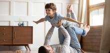 Child Custody and Child Standard displayed via a dad and a child playing